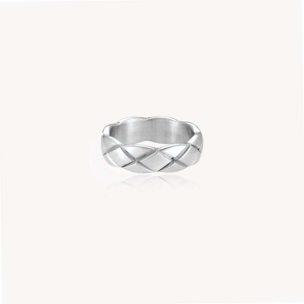 Braided stainless steel band ring with geometric interwoven strands in brushed silver finish on white background