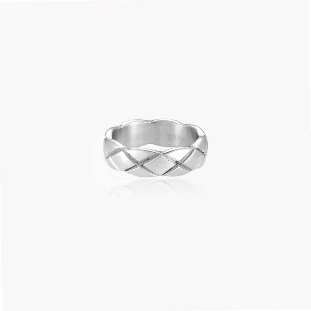 Braided stainless steel band ring with geometric interwoven strands in brushed silver finish on white background