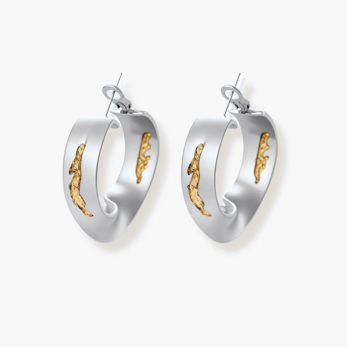 Artistic jewelry set featuring curved silver pendant with gold veining on black cord plus matching asymmetrical hoop earrings