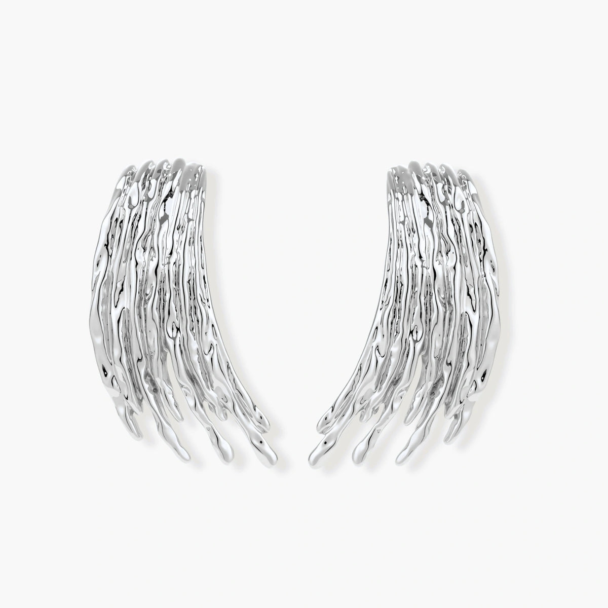 Layered metallic wing-shaped pendant and matching earrings with feathered texture in silver and gold finishes